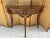 Exhibiting the pinnacle of Italian artisanal craftsmanship, this exquisite neoclassical demilune console table is from...
