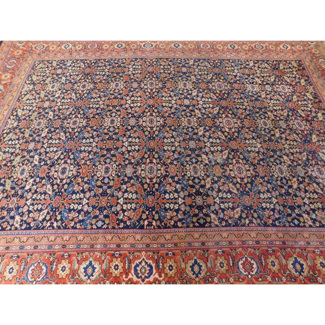 Blue field with intricate trellis design within turtle decorated border.