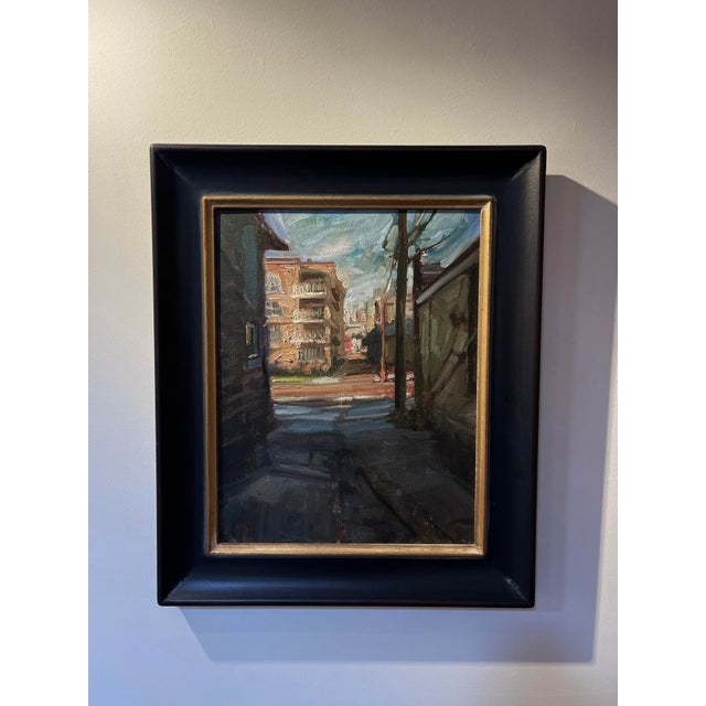 Golden Triangle Sunset captures a serene urban alley bathed in warm, golden light as the sun sets. The interplay of...