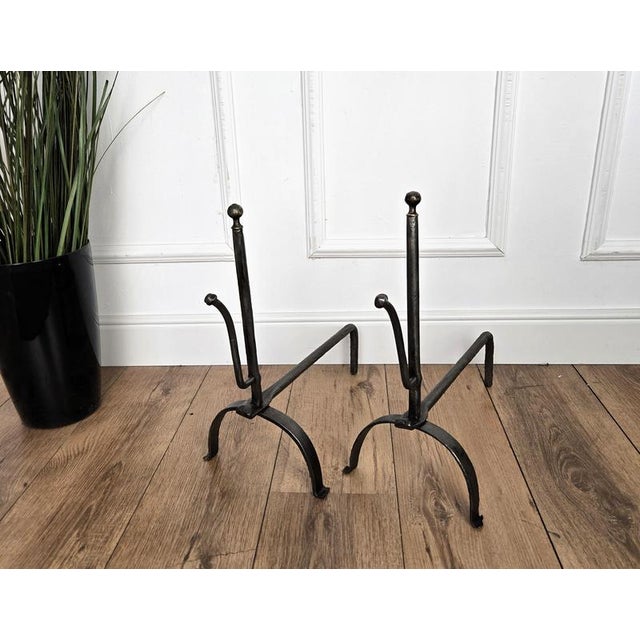 Antique wrought iron Italian andirons log holder, having two beautiful classic shapes with the great handmade craftmanship...