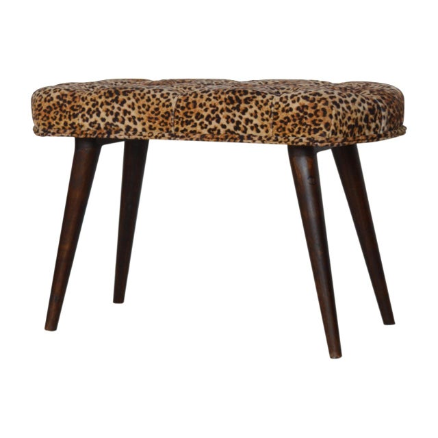 Upholstered in a bold leopard-print velvet, this bench adds a playful yet refined accent to hallways or bedrooms....