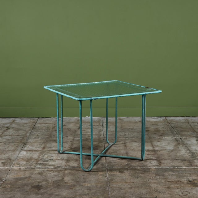 A small patio dining or card table in patinated bronze, designed by Walter Lamb and produced by Brown Jordan. The table...