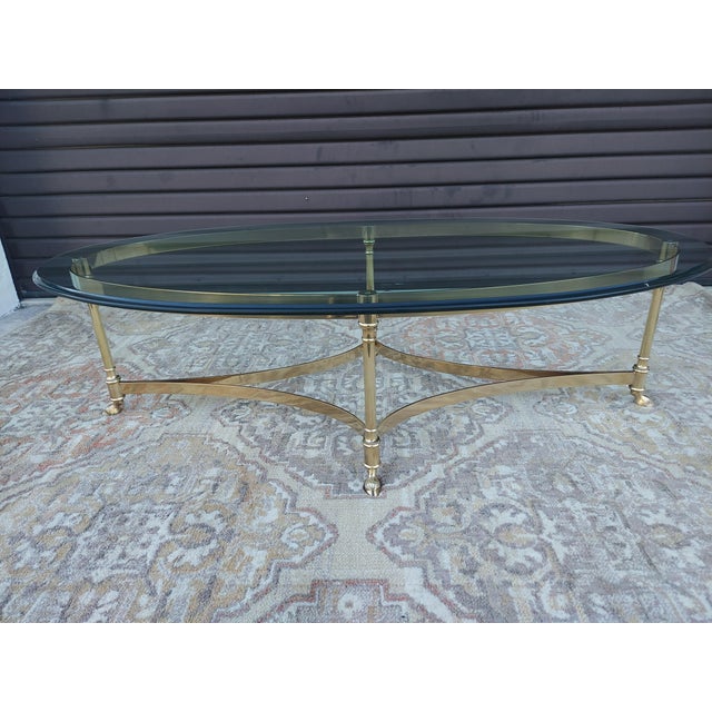 Mid-Century Modern Vintage Hollywood Regency Brass Oval Coffee Table Glass Top and Hoof Detailed Feet. For Sale - Image 3 of 5