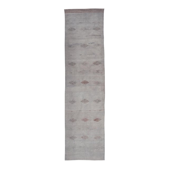 Vintage Turkish Kilim Runner With Subtle Geometric Patterns and Soft Pastel Tones For Sale