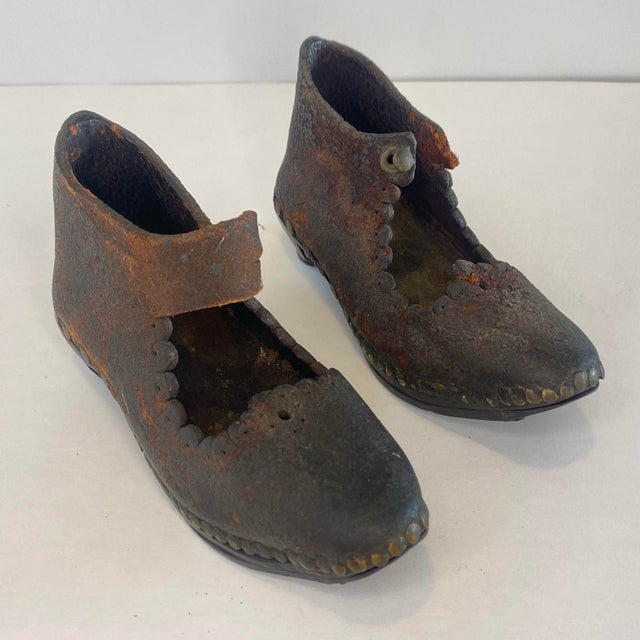 Antique Victorian era handmade children's shoes showcase exceptional 19th-century craftsmanship, constructed from a...
