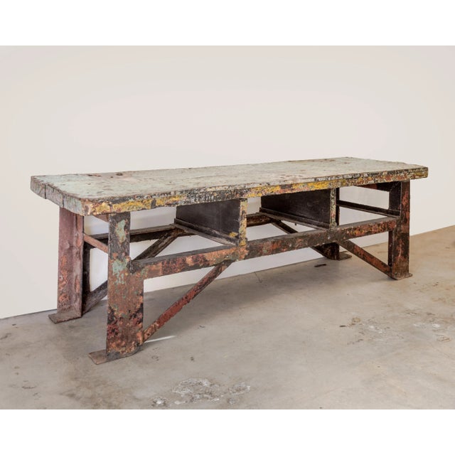 Super industrial table with metal clad wood plank top and steel base, incredible patina, solid and handsome, U.S. mid-20th...