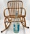 Vintage mid-century modern child's rattan and bamboo rocking chair. This distinctive design draws heavily from the iconic...