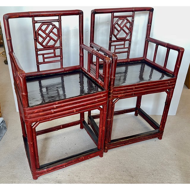 Just arrived this exceptional Pair of 19Th C. Chinese Bamboo Armchairs a rich Maroon and Black color.. These chairs have...