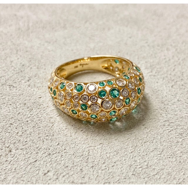 Created in 18 karat yellow gold Diamonds 1.20 ct approx Emeralds 0.55 cts approx Ring size US 6.5, can be sized up or down...