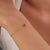 This delicate station chain bracelet features a 0.35 ct heart-shaped orange sapphire, set in 14K yellow gold. It measures...