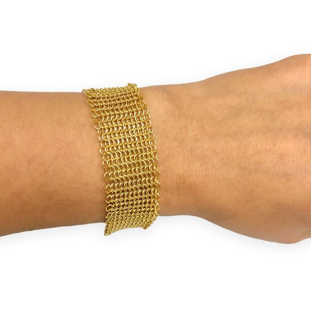 A Vintage Elsa Peretti mesh bracelet in 18K yellow gold, designed with her signature fluid drape and textile-like...