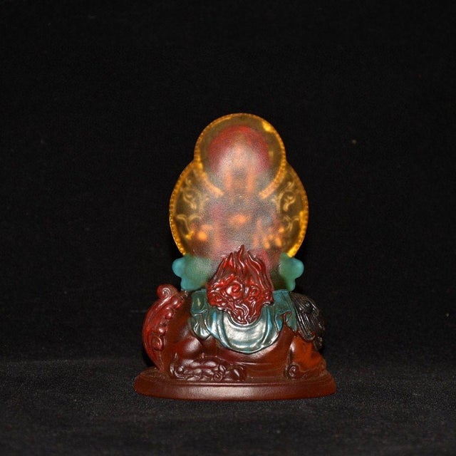 This exquisite vintage Chinese sculpture features a finely crafted depiction of Guanyin Bodhisattva riding a lion. The...