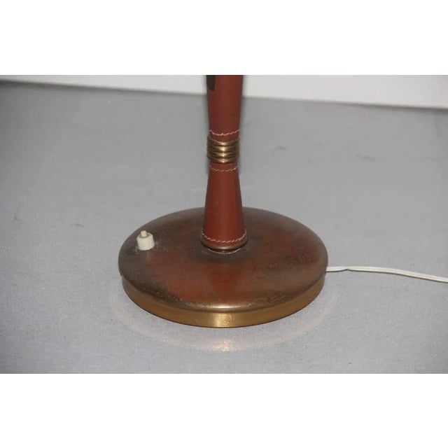 This Mid-Century Italian table lamp was produced by Lumi in the 1950s. The piece is reminiscent of the designs by Oscar...