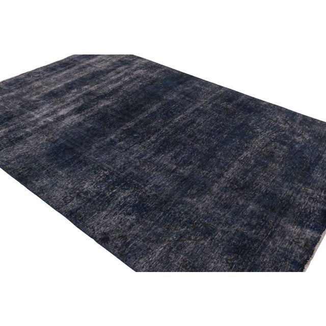 From our new collection of overdyed rugs, a vintage 8x12 Persian rug originating circa 1970-1980 or possibly earlier. On...