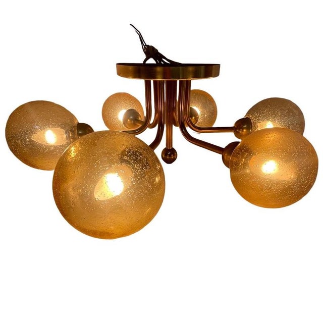 Vintage midcentury modern / atomic age sputnik style chandelier. Made from a brass framework that supports 6 patterned...