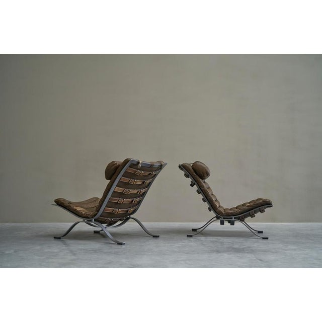 Arne Norell Pair of 'Ari' Lounge Chairs in Steel and Patinated Leather, Sweden 1960s A very nice pair of Arne Norell ‘Ari’...