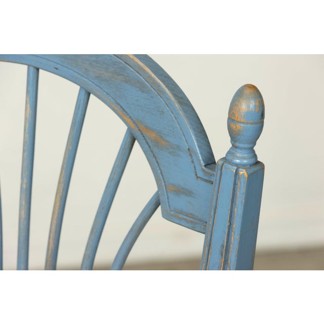 A charming early 20th century set of six French Louis XVI style painted wood and rush dining chairs, sourced in Paris,...
