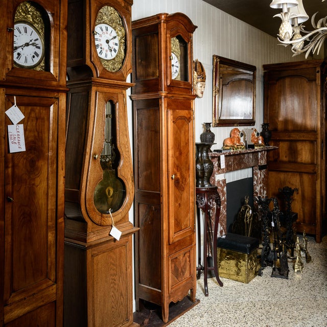 C.1860, French provincial cherry Grandfathers clock. Burlwood and pressed brass face with a long brass hinged door and...