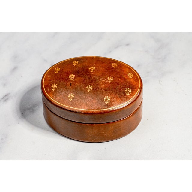 A charming example of mid-century Italian luxury, this petite oval leather box combines refined craftsmanship with...