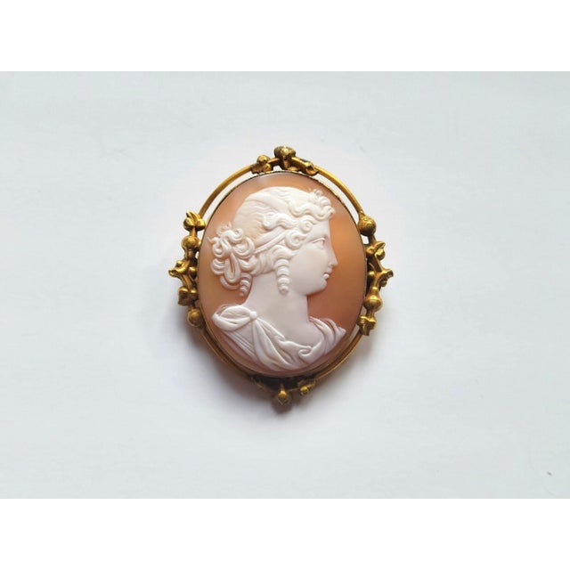 A refined and highly accomplished Victorian shell cameo brooch, confidently dated to the mid-19th century, rather than the...