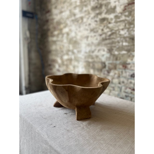 Natural beauty, artful form. These hand-carved wooden bowls make a striking statement with their fluid, organic shapes and...