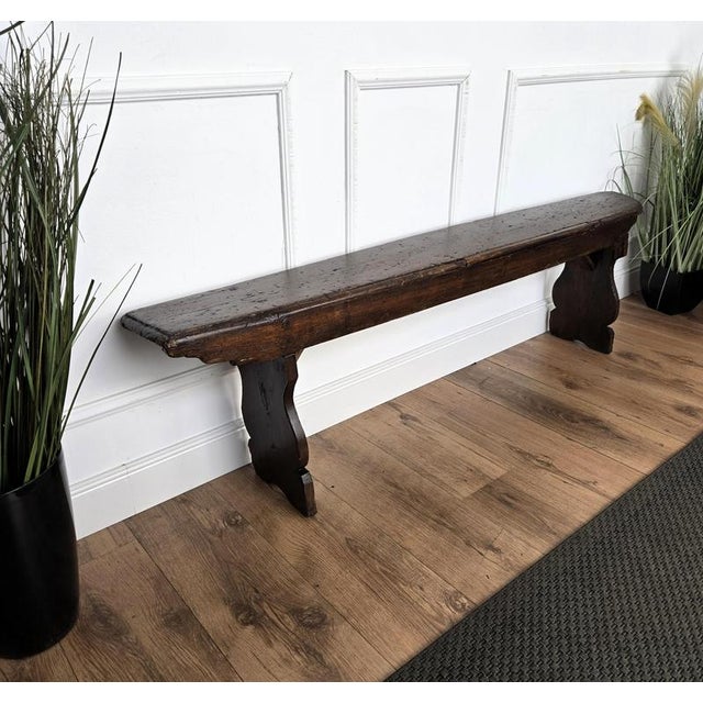 Beautiful Italian rustic primitive country wooden bench, with trestle style legs in original aged natural color giving the...