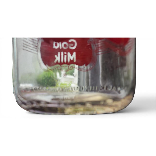 Vintage Meadow Gold Glass Quart Milk Bottle w/ Red Graphics, 1960s. Great condition. Measures 9.75 inches high