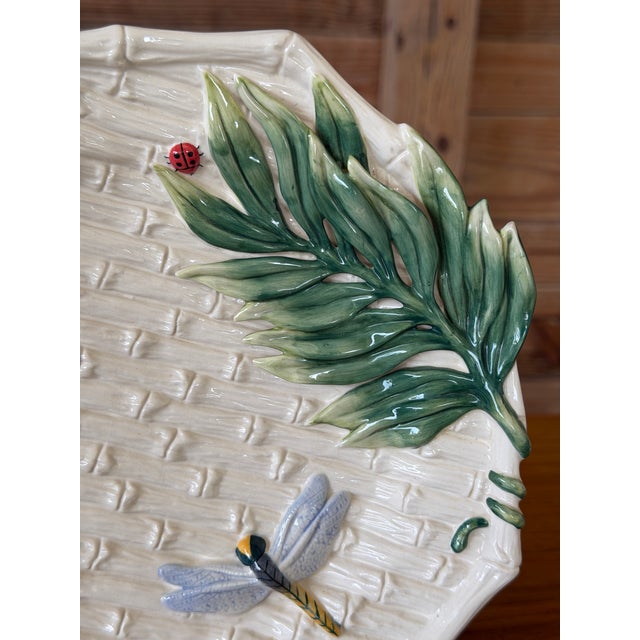 Whimsical vintage decorative plate by Fitz & Floyd Classics featuring a richly detailed tropical design with raised palm...