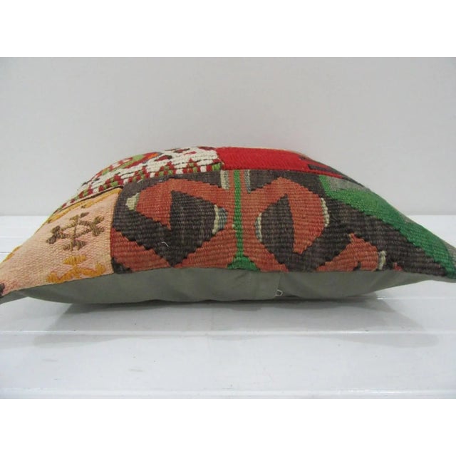 This is a pillow cover made from a vintage kilim rug. The piece was properly washed and ready to use. Pillow inserts not...
