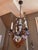 Antique patinated bronze, Louis XV -style four arm, chandelier with amethyst-color grape clusters and clear crystal...