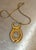 1970s-80s gold-tone/carved lucite cameo pendant necklace. Excellent condition.
