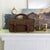 A pair of early 20th-century British Woods Lawn Bowls, complete in their original bowls bag. The wooden balls feature bone...
