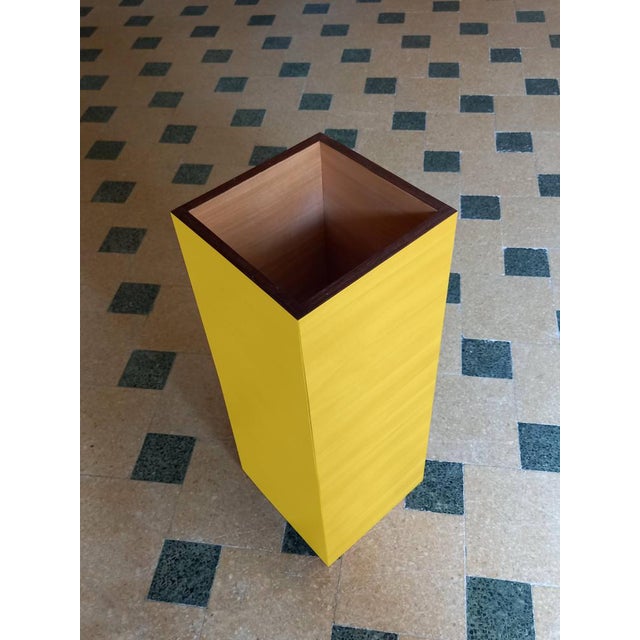 "Plinto Giallo" umbrella stand by Pietro Meccani for Meccani Design. A stunning design piece crafted from light walnut...