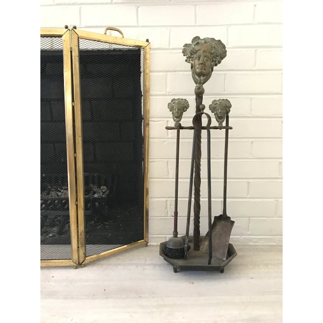 A charming antique set of French, brass fireplace tools. Large and two smaller visages depict Hestia, the Greek goddess of...