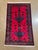 Hand-knotted Baluch rug, traditionally woven by tribal groups of eastern Iran and Afghanistan. Features a vivid magenta-...