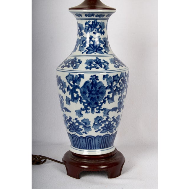 Beautiful overall floral attern, lovely form, mounted on a older rosewood stand, matching top cap. the height is given...