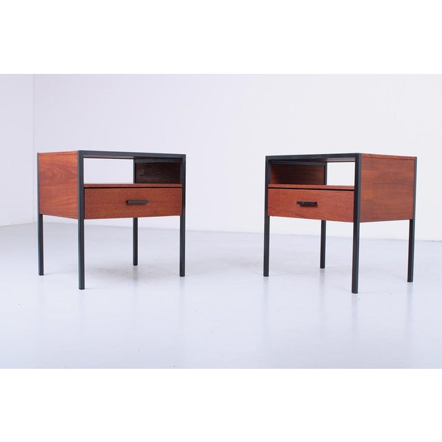 Great teak veneer nightstands by Auping, 1963. The fine teak material makes a warm complement to the dark grey iron frame...