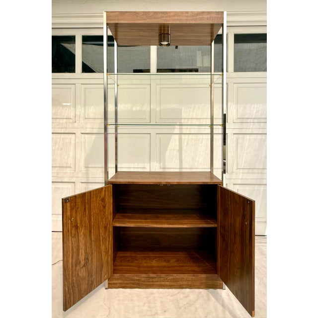 Here is a really great Mid-Century Modern etagere with lots of storage and display area! It features a chrome base with...