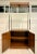 Here is a really great Mid-Century Modern etagere with lots of storage and display area! It features a chrome base with...