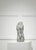Striking vintage sculpture crafted from fine wire mesh, depicting an abstract nude female form. The translucent quality of...