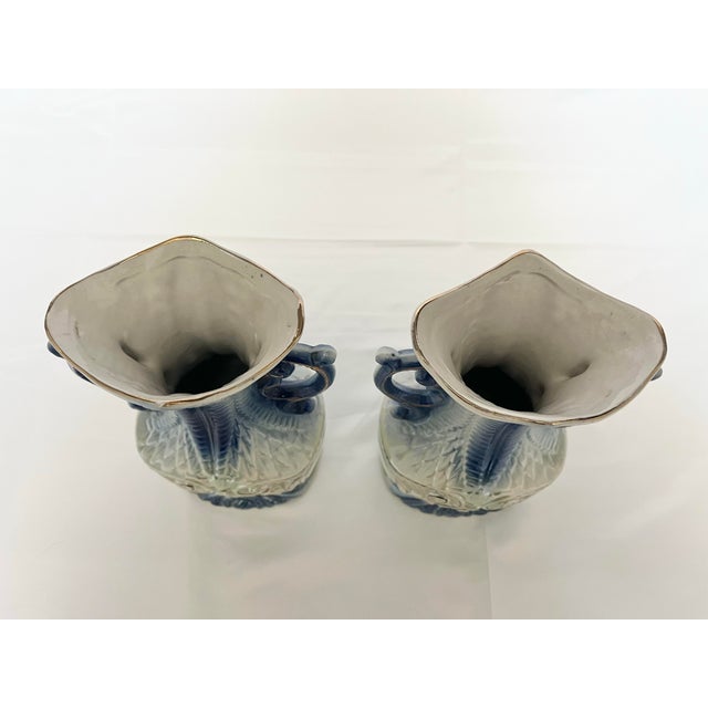 Elevate any shelf or tabletop with this identical pair of vintage ceramic vases from Brazil, featuring an elegant...