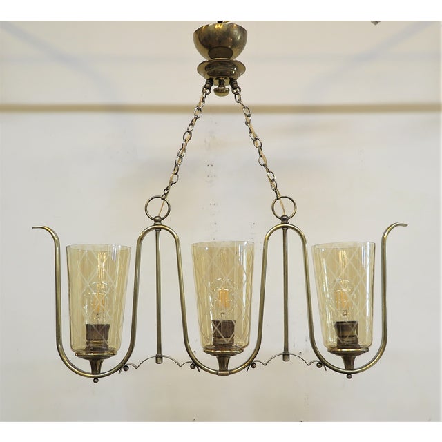 rench Mid Century Horizontal Chandelier in the Style of Jean Royere. French Serpentine Horizontal Brass Chandelier in the...