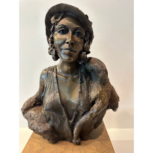 One of the earliest works by renowned artist George Lundeen. This wonderful bronze bust of woman in a fur coat sculpted in...