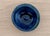 A small signed studio pottery bowl or ring dish with a richly layered cobalt blue and blue-green glaze. The hand-thrown...