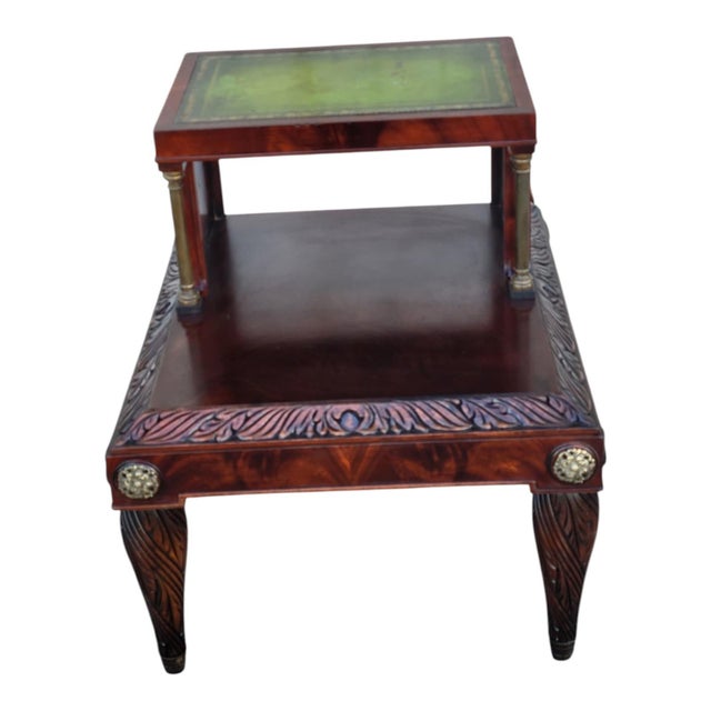 Elegant antique side table crafted from richly figured mahogany, featuring a hand-tooled green leather top with gilt...
