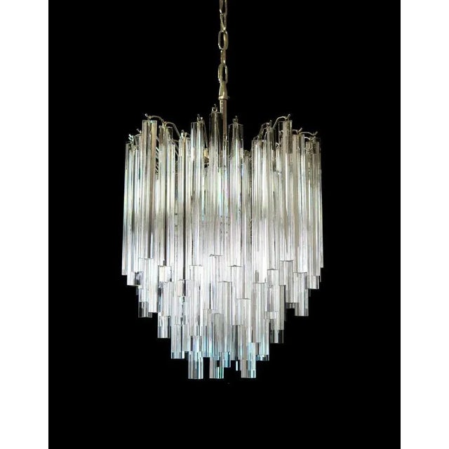Fantastic pair of Murano chandelier made by 92 Murano crystal prism "triedri" in a nickel metal frame. The glasses are two...