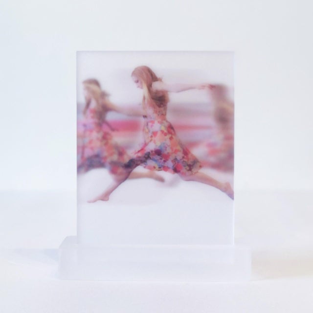 This artwork features a dynamic composition across five acrylic panels, capturing the essence of movement with a figure in...