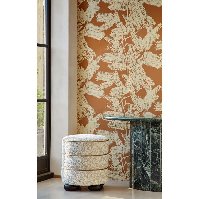 Silhouetted ferns adorn this wallcovering in a shadowy canopy effect produced in three earthy colourways. This two-tone...