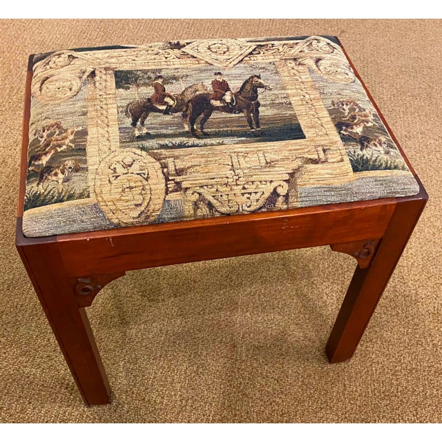 Hand crafted wooden stool with hand carved hunting horn detail and hunt tapestry tight seat cushion.