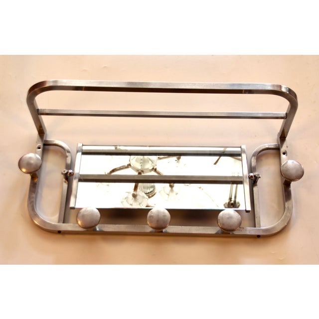 Original Art Deco wall coat rack from France with a rotating and side-framed mirror. It was made in the 1940s from...